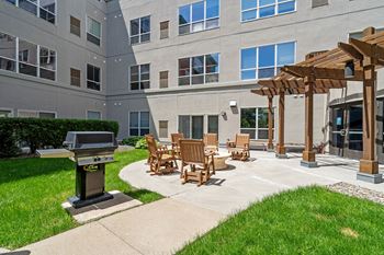 Landscaped courtyards with outdoor fireplace and grills